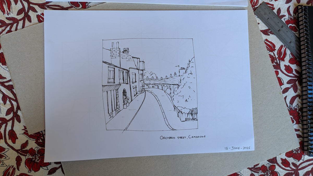 A line sketch of Orchard Street in Cambridge on a desk. The sketch is made with a 0.5 fine-liner on a sheet of A4 printer paper